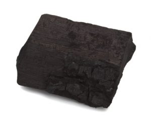 Wooden coal piece on the white background